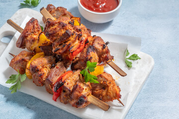 Grilled pork kebab with red and yellow pepper