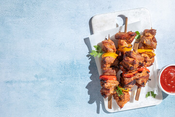 Grilled pork kebab with red and yellow pepper