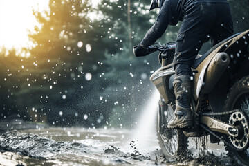 man washing mud off an offroad motorcycle - obrazy, fototapety, plakaty