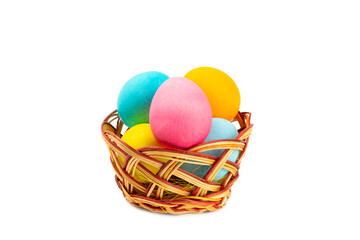 Easter basket filled with colorful eggs isolated on white background. Easter celebration concept. Colorful easter handmade decorated Easter eggs.