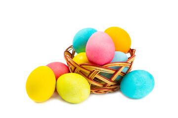 Easter basket filled with colorful eggs isolated on white background. Easter celebration concept. Colorful easter handmade decorated Easter eggs.