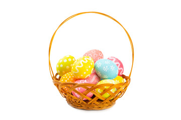 Fototapeta na wymiar Easter basket filled with colorful eggs isolated on white background. Easter celebration concept. Colorful easter handmade decorated Easter eggs.