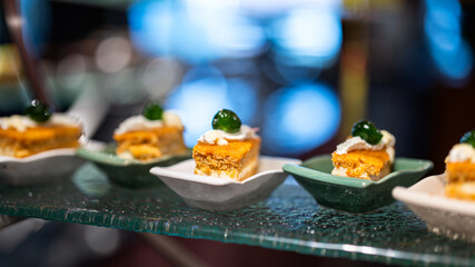 Small pieces of various tasty cake, there are placed on the international buffet meal. Sweet...