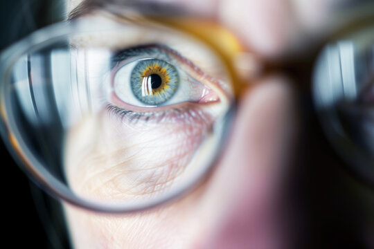 close up of a persons eyes seen through bifocal lenses