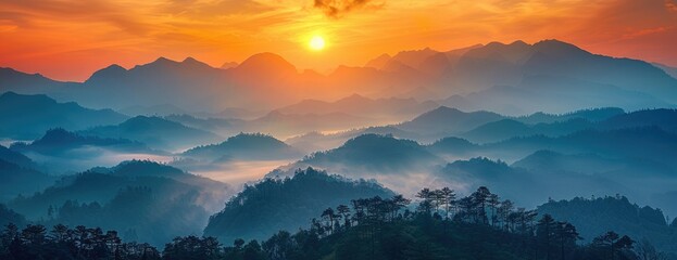 Radiant Dawn: Breathtaking Sunrise Illuminates Rugged Mountain Peaks and Misty Forest Below - obrazy, fototapety, plakaty