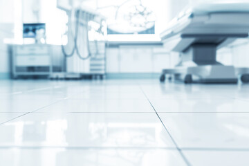 pristine white floor tile in focus with faded image of a surgery above