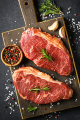 Beef steak. Raw beef meat at black.