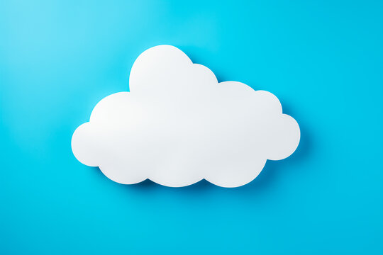 White paper cloud shape on blue background