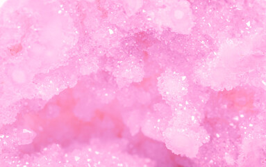 Amethyst pink crystals. Gems. Mineral crystals in the natural environment. Texture of precious and semiprecious stones. Seamless background with copy space colored shiny surface of precious stones.