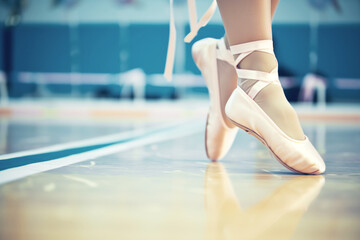 dancers feet in ballet slippers on a studio floor line