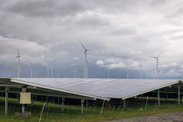 Green energy together with wind turbines and solar parks to combat climate change and reduce carbon...