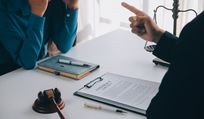 Justice and Law concept. Legal counsel presents to the client a signed contract with gavel and...