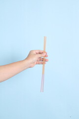 hand holding the incense sticks