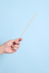 hand holding the incense sticks