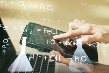 Double exposure of creative chemistry concept with finger clicks on a digital tablet on background,...