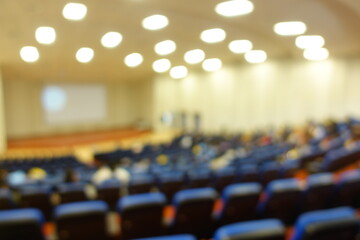 blurred or defocused people in the seminar convention hall. Business meeting for a press conference...