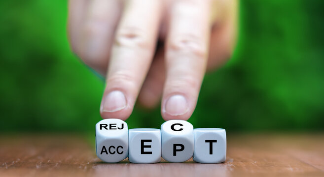 Hand turns dice and changes the word accept to reject.