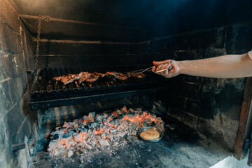 Typical Argentinian barbecue or asado. hand