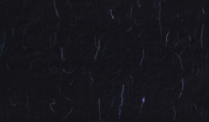 Natural chinese floral decorative black paper texture with blue fibers.