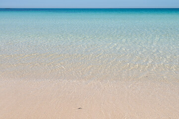 Transparent seawater at the sand beach in Udo Island