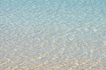 Transparent seawater at the sand beach in Udo Island