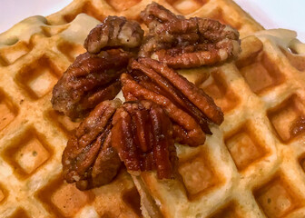 Waffles topped with candied pecans