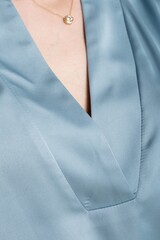 Closeup of elegant womans blouse collar v-neckline