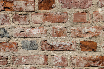 Abstract background from warped antique brick wall.