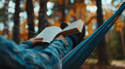 A person curled up with a good book in a hammock outdoors, surrounded by nature, epitomizing relaxation and escapism, mental health in a positive light, blurred background, with copy space