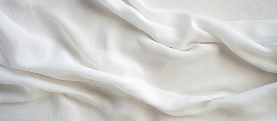 A detailed view of a white sheet crumpled on a bed, showcasing the texture of the linen fabric. The natural and organic material adds a touch of elegance to the bed.