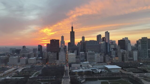 Aerial video of Chicago, Illinois, USA.. Beautiful sunset behind the city skyline. 2024.