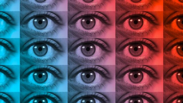 Close up shot of macro eye opening and blinking in Pink-blue-green color light. Female pink eye in neon lights. Macro look of the human eye.