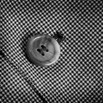 Detail of Suit Button on Black and White Checkered Suit Jacket