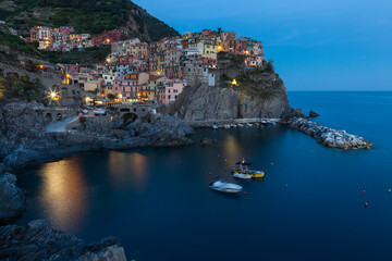 Manarola village on cliff and sea at sunset., Cinque Terre National Park, Liguria Italy Europe.