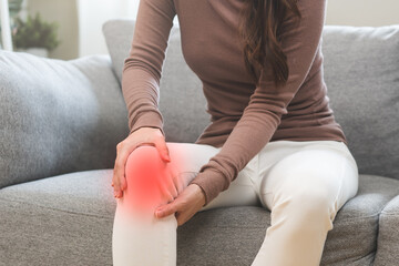 Health care of knee pain concept, close up hand of woman arthritis sitting joint ache, sore cramp...