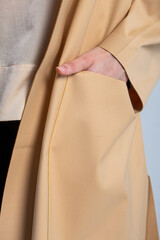 Elegant beige coat with large front pockets for women fashion