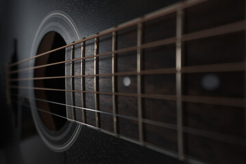 Close-up of an acoustic guitar. Selective focus - obrazy, fototapety, plakaty