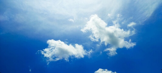 Blue sky clouds background. Summer clouds wallpaper.