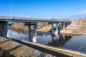 steel frame and concrete construction huge car bridge across the wide river