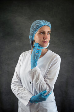 Portrait Of Pretty Young Smiling Medical Worker In Uniform