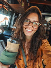 Happy young woman taking selfie with coffee cup. Vacation on holiday concept. 