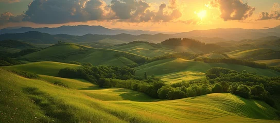 Rolgordijnen Breathtaking Tuscan landscape with undulating hills illuminated by a soft sunset light © Vladan