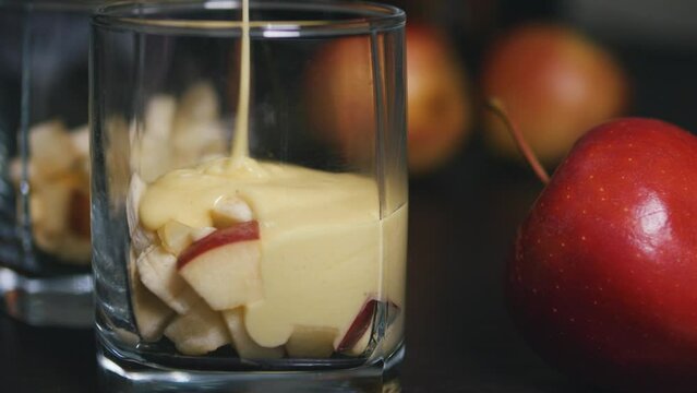 Pouring zabaione zabaglione sabayon sauce into a glass. Italian dessert.