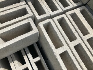 Concrete blocks stacked for construction, a solid foundation for architectural projects.
