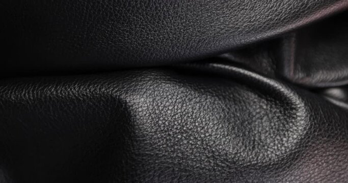 Wrinkles of natural leather. Check quality and testing of natural soft leather, material for craft and hobbies accessories, macro.