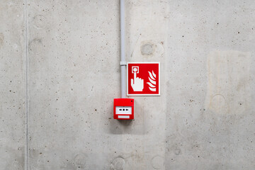 Fire alarm red button. Concrete wall. Emergency alarm.