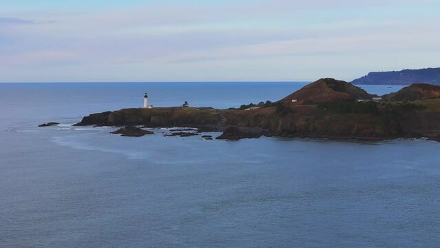 Yaquina Head Lighthouse- R to L pan, crane up reveal Cape Foulweather.  Pacific Coast Video