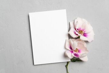 Blank wedding or greeting card mockup with flowers, white card mock up with copy space