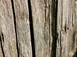 very old wooden surface, backdrop, background. Front view of an old wooden fence for inscription.