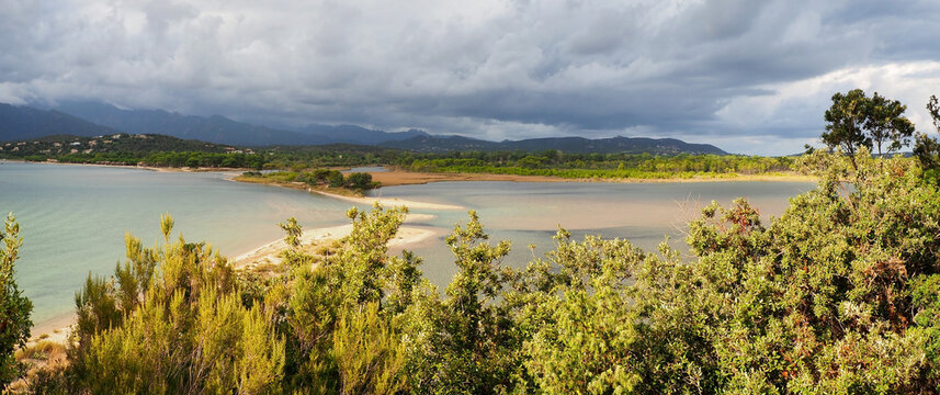 Panoramic view of the pretty lagoon bordering the small road leading to Benedettu beach in the town of Lecci in Corsica, nicknamed the Isle of Beauty